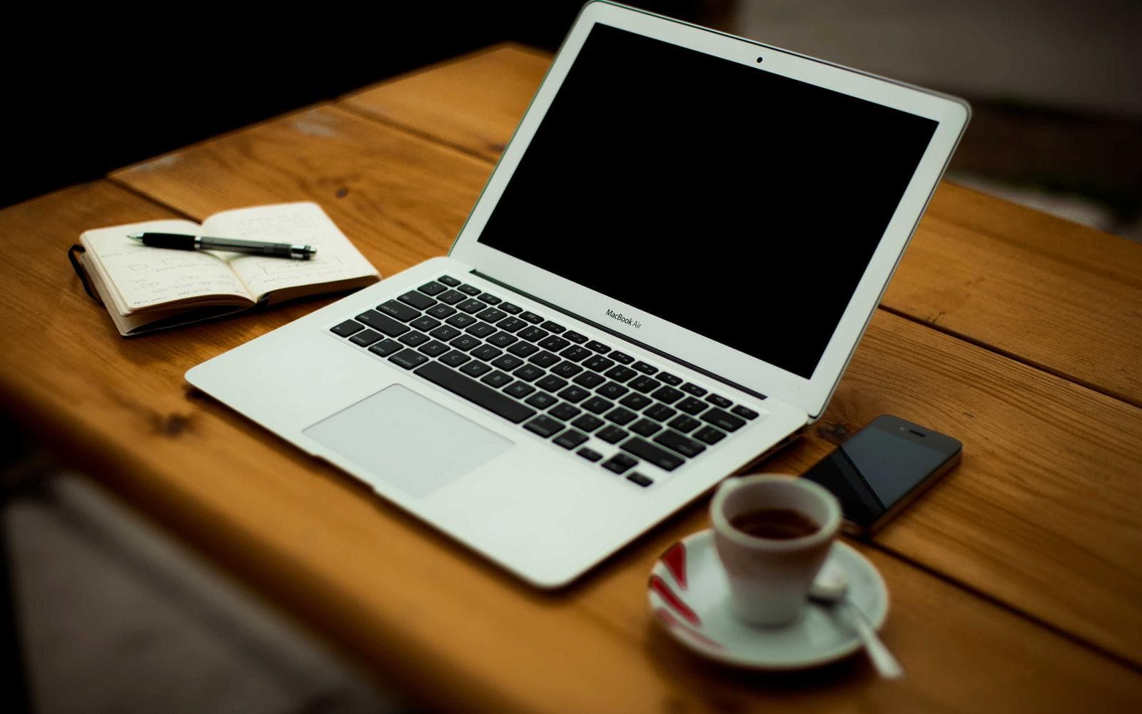 A laptop on a wooden desk